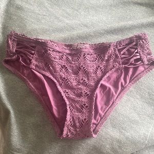 BECCA swimsuit bottoms. Lightly worn. Cute crossover detailing on the side.